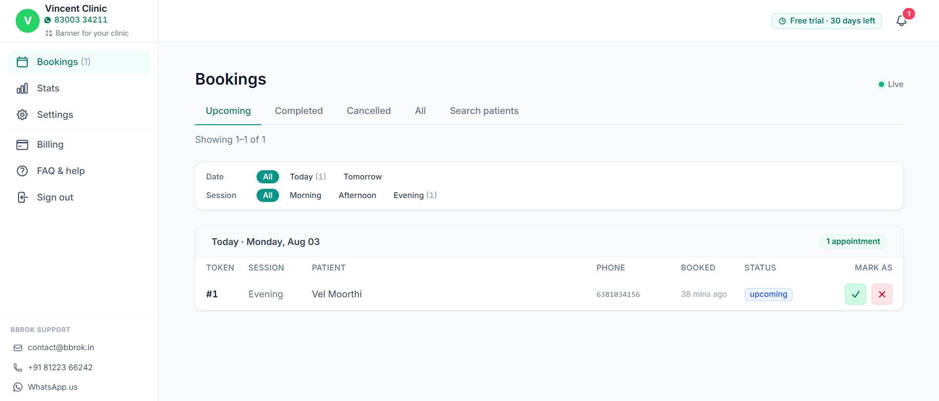The Bbrok clinic dashboard showing today's bookings: token number, session, patient name, phone, status, and quick mark-complete or cancel buttons.